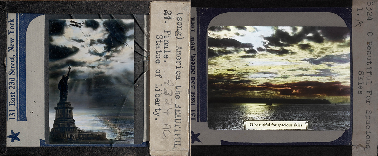 Two hand-painted glass lantern slides, one showing the Statue of Liberty and another with the first line of 