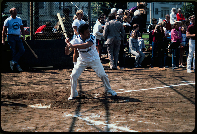 Color photo of Zubin Mehta at bat during a softball game.