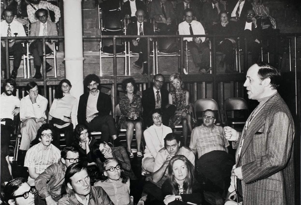 Black-and-white photo of Pierre Boulez speaking to an audience in 1971.